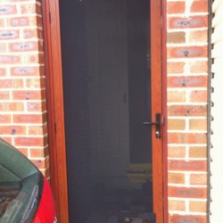 Stainless Screen Door with pet door western red cedar color